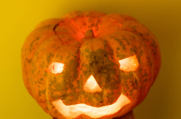 Halloween day. Pumpkin with lights representing a popular party in the United States. Decoration for children on Halloween. Folklore. - Photo, Image