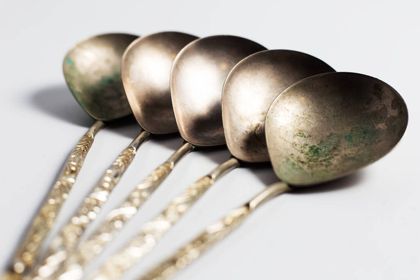 Collection of ancient spoons. On background of white. - Photo, Image