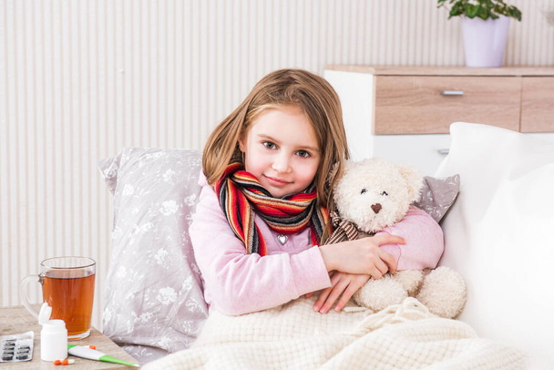 Little ill girl with scarf - Photo, Image