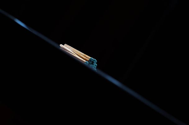 Close-up of fire matches isolated on black. - 写真・画像