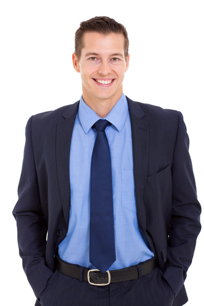 happy businessman posing with hands in pockets - Фото, изображение