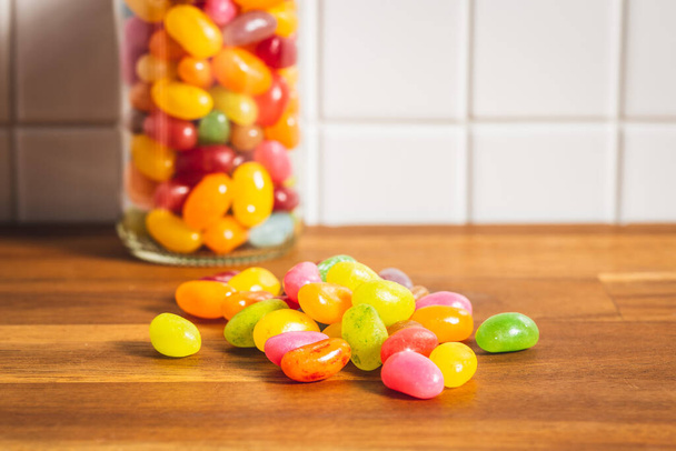 Fruity jellybeans. Tasty colorful jelly beans on kitchen table. - Foto, Bild