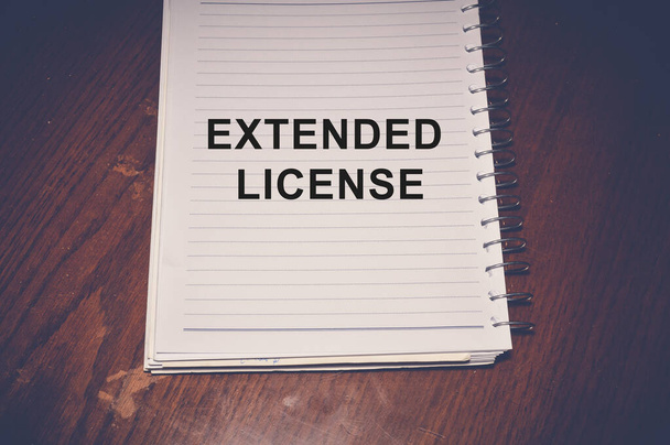 Extended license word written on white paper - Photo, Image