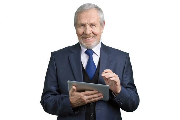 Portrait of mature smiling man with tablet. - Foto, afbeelding