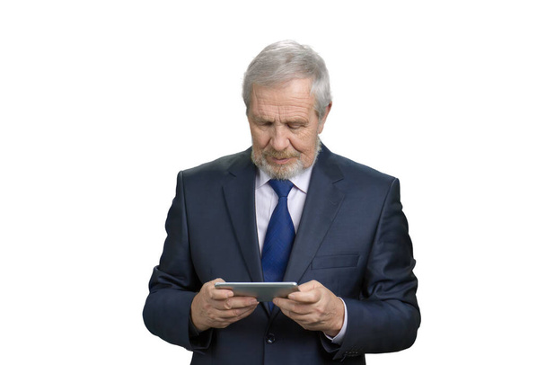 Old businessman playing games on smartphone. - Fotó, kép