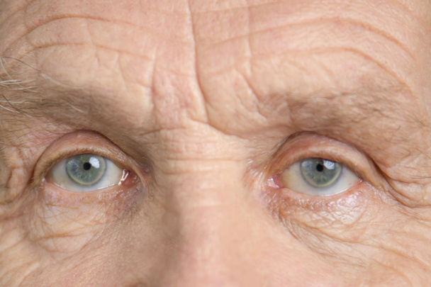 Widely opened blue grandpa eyes. - Photo, Image