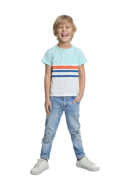 Happy little boy in casual outfit on white background - 写真・画像