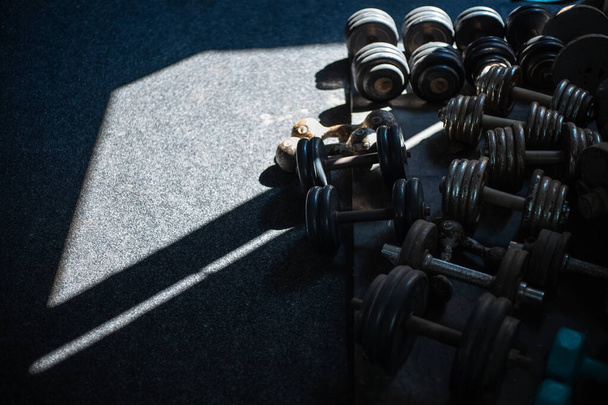 Close-up of many dumbbells stuff for gym. - Foto, afbeelding