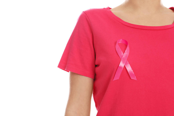 Woman with pink ribbon on white background, closeup. Breast cancer awareness - Foto, immagini