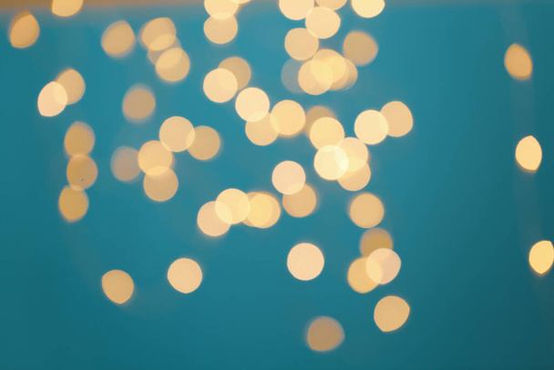 Blurred view of beautiful lights on blue background - Фото, зображення