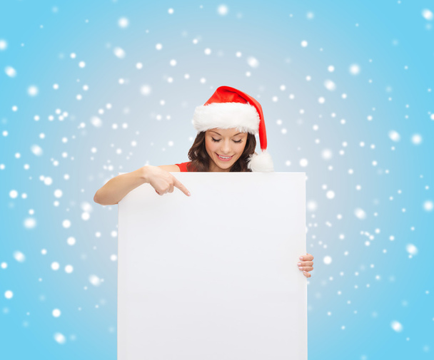 Woman in santa helper hat with blank white board - Фото, изображение