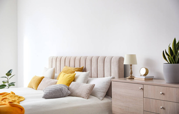 Stylish interior of contemporary room with comfortable bed - Фото, изображение