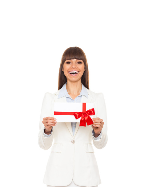 Business woman happy smile hold gift card present with red bow. - Foto, immagini