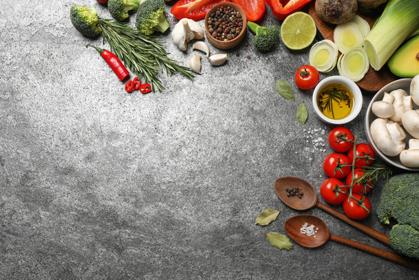 Flat lay composition with fresh products on grey table, space for text. Healthy cooking - Foto, immagini