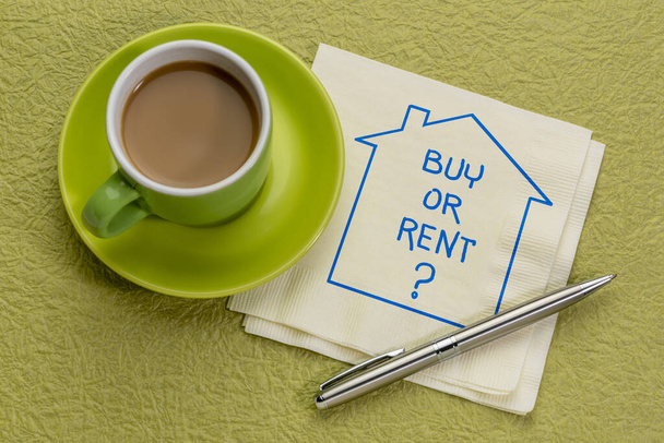 Buy or rent? Sketch and handwriting on napkin with coffee. Choice, decision, question about buying or renting house or apartment. - Fotografie, Obrázek