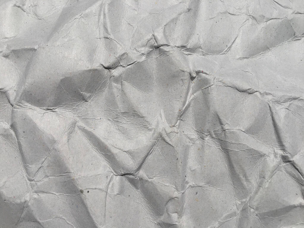 Horní pohled na bílé zmačkané papírové textury pozadí. Kopírovat prostor pro design a umělecké dílo - Fotografie, Obrázek