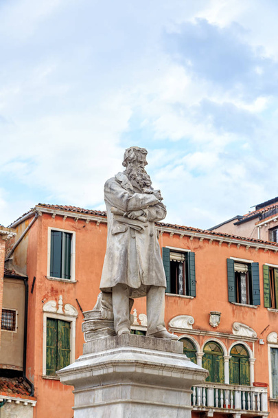 Venice, Italy. A large marble monument to the Italian linguist, journalist and writer Niccolo Tommaseo. Sculptor Francesco Barzaghi (1839 - 1892) - Photo, image