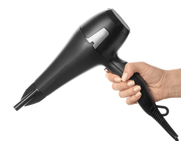 Female hand with modern hair dryer on white background - Photo, Image