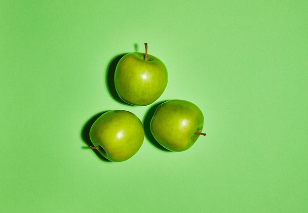 Apple on green background. Flat lay, top view, copy space . Food dietary concept. - Photo, Image
