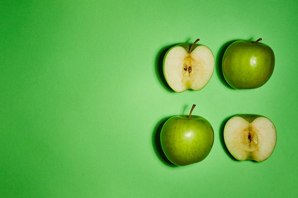 Apple on green background. Flat lay, top view, copy space . Food dietary concept. - Fotó, kép
