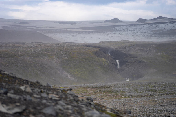 Volcanic landscape with glacier, rocks and ash on the Fimmvorduhals hiking trail. Iceland - Fotó, kép