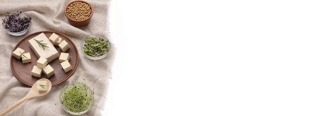 Fresh tofu, microgreens top view white background - Фото, изображение