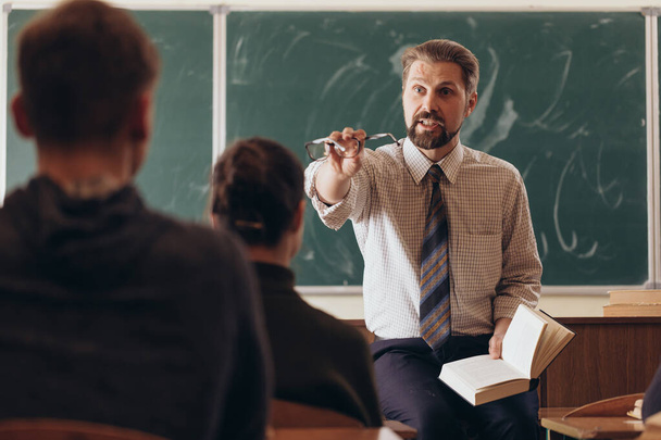 Bearded Teacher Asking His Student a Question - Valokuva, kuva