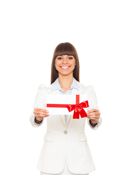 Business woman happy smile hold gift card present with red bow. - Foto, afbeelding
