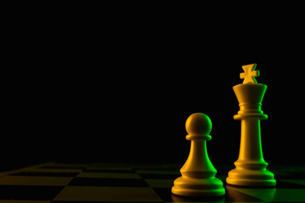 Close-up hand makes a pawn move, chess, chessboard, game, confrontation - Foto, Imagen