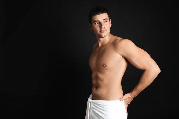 Man with sexy body on black background. Space for text - Foto, Imagen