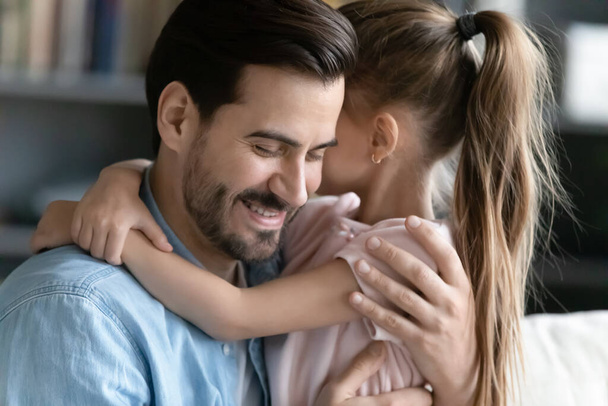 Caring little girl embrace young father showing love - Photo, Image