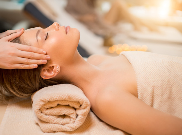 calm woman with closed eyes, get massage on head - Photo, Image
