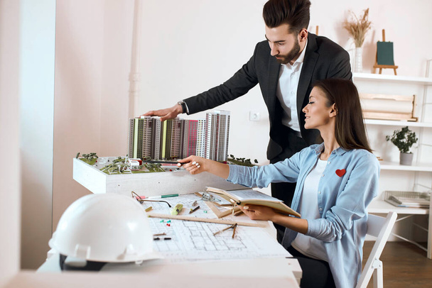 man and woman developing interior and working on the planning of buildings. - 写真・画像