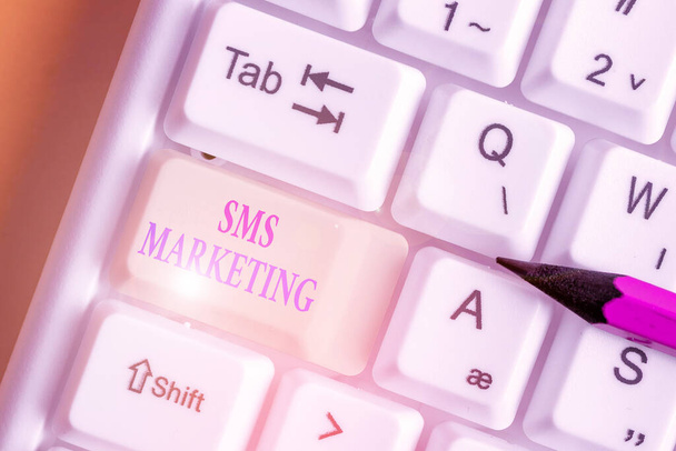 Handwriting text writing Sms Marketing. Concept meaning Effective technology for inviting clients and retain customers. - Photo, Image