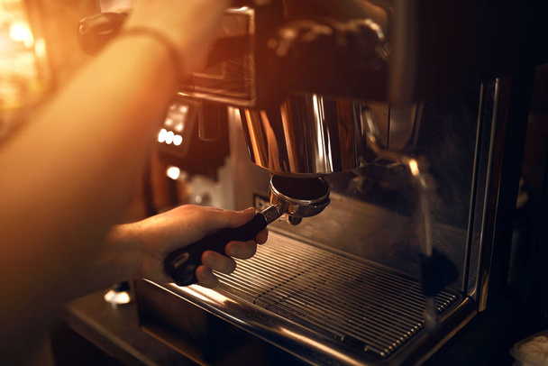 young barista working with coffee machine - Фото, изображение