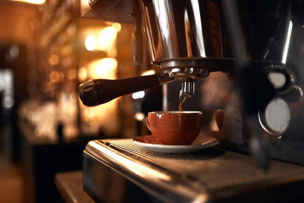 Fresh strong balc coffee prepared in the coffee machine. - Fotografie, Obrázek