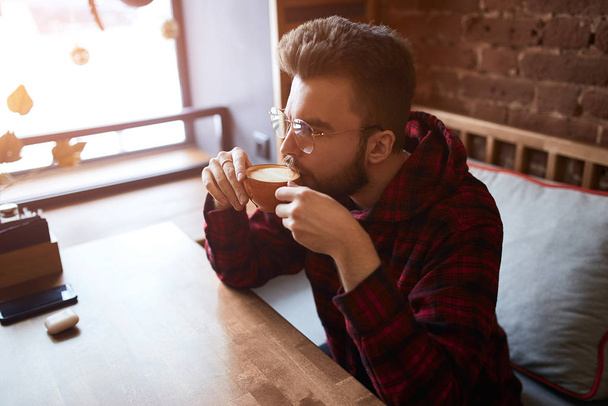 young handsome man likes coffee - Foto, immagini