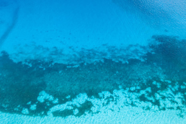 Aerial view of blue ocean with underwater coral reef, tropics.   - Foto, Imagen