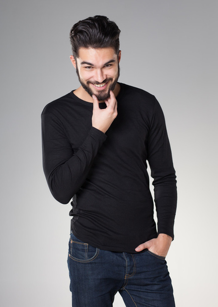 attractive sexy man with beard dressed casual smiling - Photo, Image