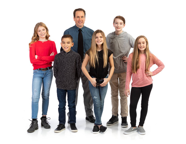 Group of kids in various poses with props, isolated on a white background. - Foto, immagini