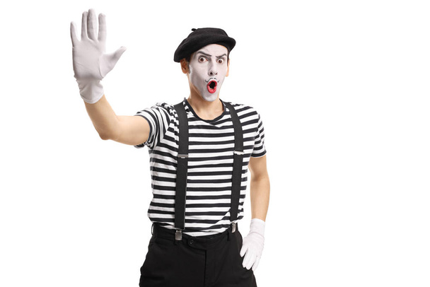 Mime gesturing stop with hand isolated on white background - Foto, Imagen