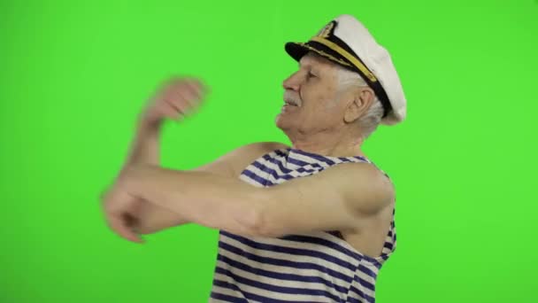 Elderly sailor man funny dances. Old sailorman on chroma key background - Video