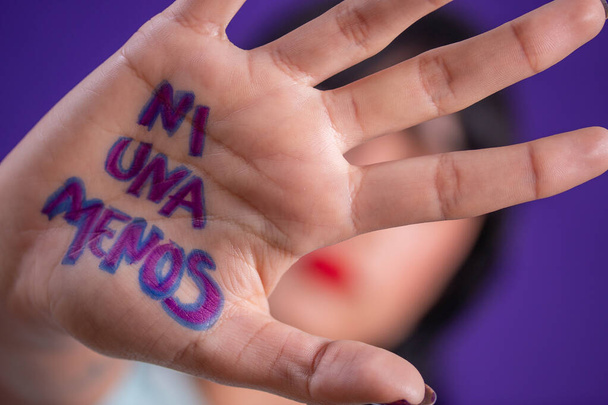 Young hispanic woman campaigning against gender based violence - Photo, Image