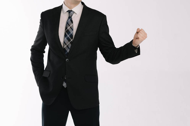 portrait of a businessman standing on a white background with fists - Photo, Image
