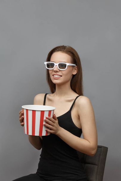 Excited girl in white 3D glasses with popcorn - Fotoğraf, Görsel
