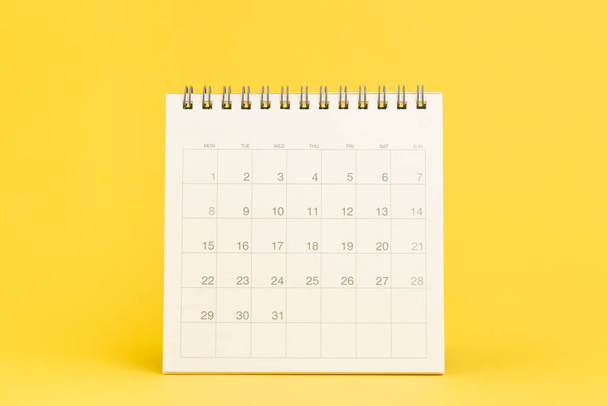 Clean desktop calendar with date 31 days on solid yellow background using as schedule planning, deadline to launch project or events and holiday reminder. - Fotó, kép