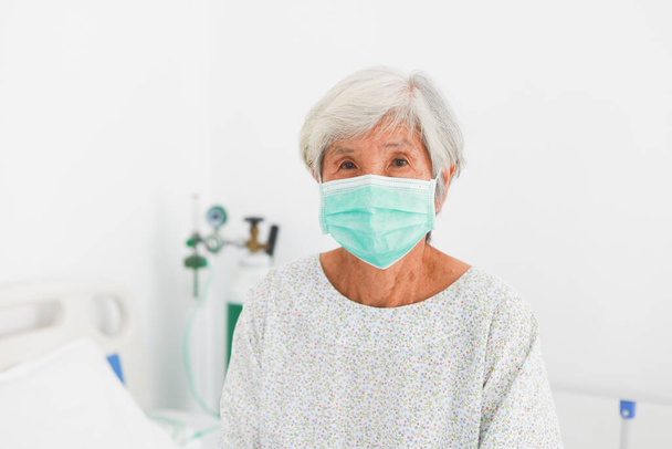 Asian old Patient woman  with mask sickness in hospital room with virus flu - Φωτογραφία, εικόνα
