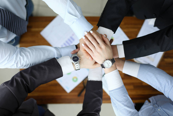 Business success concept. Group people hold together hand close up - Foto, afbeelding