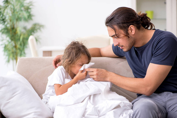 Father taking care of his ill daughter - Photo, Image