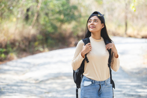 Asian young woman with backpack hiking, travel concept. - Foto, imagen